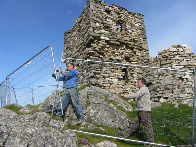 Building Contractor John (Eddie) Doherty and David McLaughlin erecting security fence.