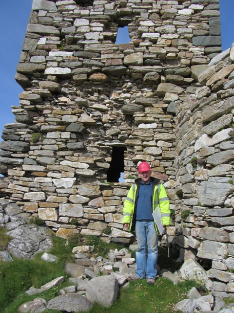 Project Archaeologist, Richard Crumlish examining south wall of keep before making site drawings.